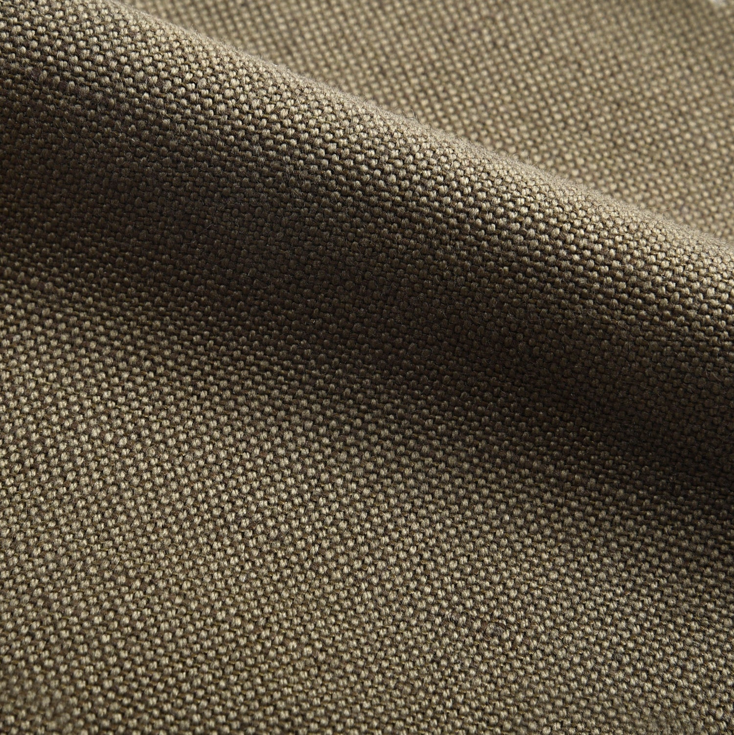Close up view of custom linen canvas pants for men by Luxire in military olive